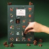 Advent calendar verde cu ciocolata in forma de figurine de Craciun